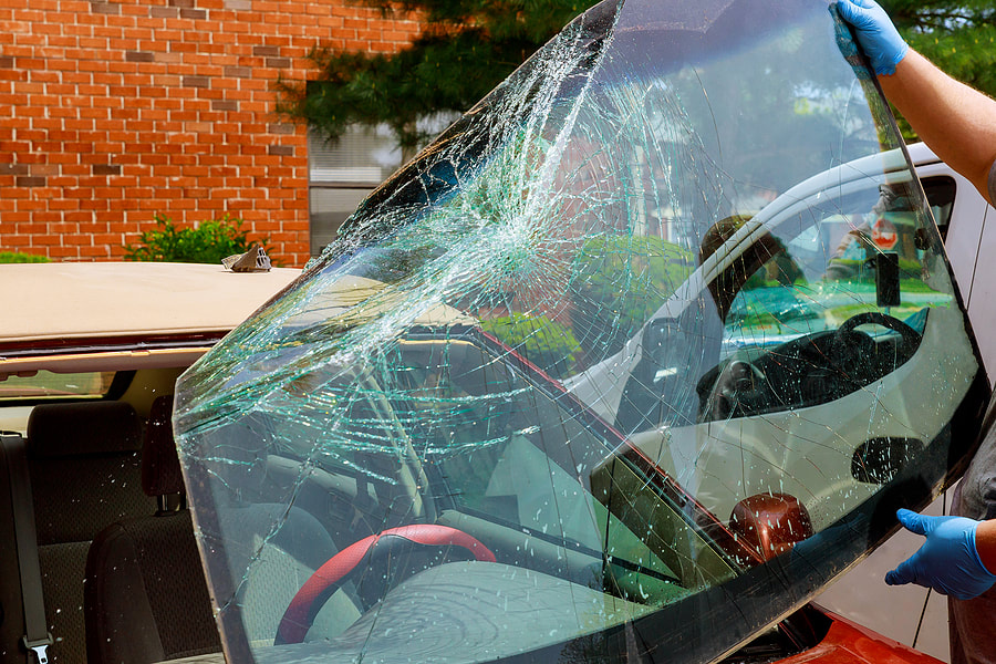 broken windshield being replaced